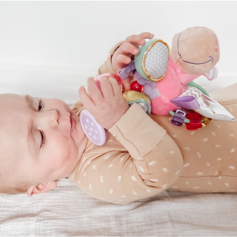 Jucarie din plus, Playgro, Stimuleaza dezvoltarea senzoriala, Utila pentru dentitie, Cu diverse forme si texturi, Cu margele si parti zornaitoare, 0 luni+, Unicorn Activity Rattle